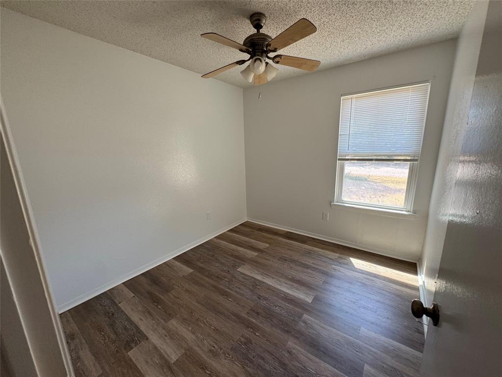 3757 Trinity Lane Abilene, TX 79602 - Photo 37 of 40 wooden floor in an empty room with a window
