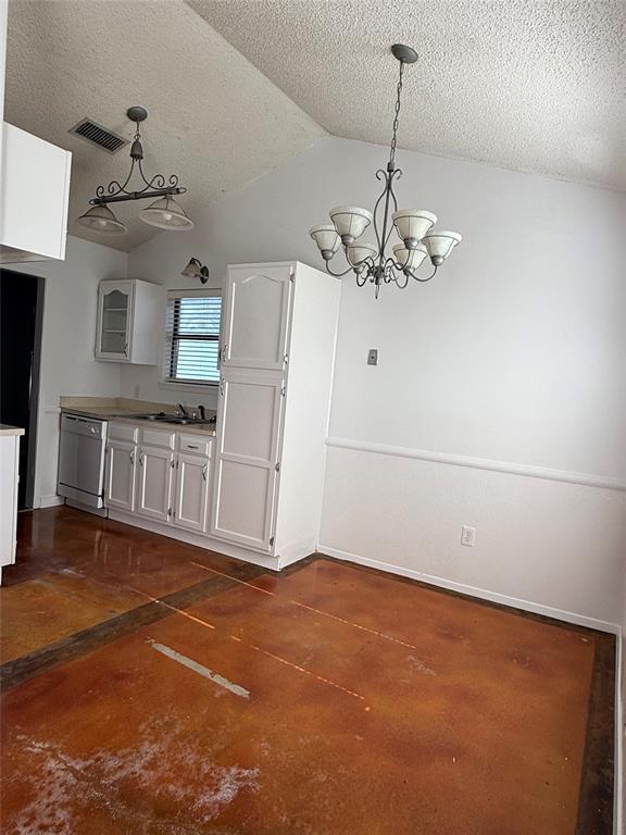 3757 Trinity Lane Abilene, TX 79602 - Photo 10 of 40 a view of a livingroom with an empty space and a chandelier