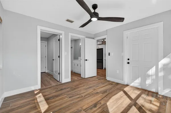 a bedroom with a bed and a hallway