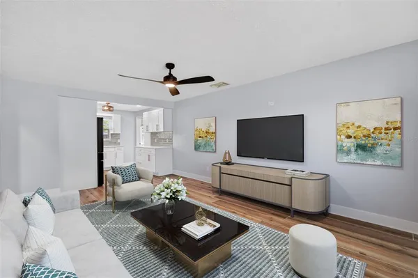 a living room with furniture and a flat screen tv