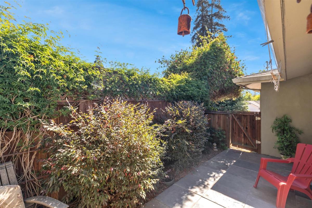 406 Pine Street, Unit A Capitola, CA 95010 - Photo 15 of 32 a backyard of a house with lots of green space
