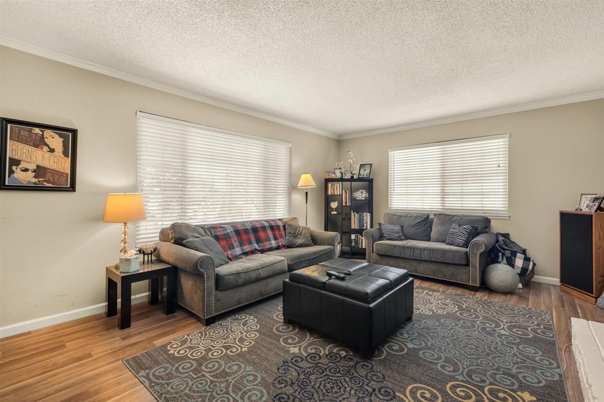 406 Pine Street, Unit A Capitola, CA 95010 - Photo 16 of 32 a living room with furniture and a window