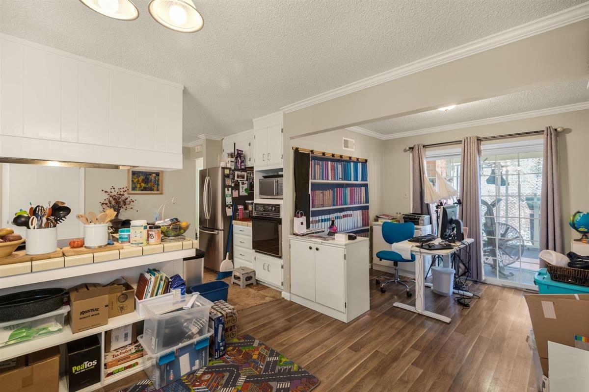 406 Pine Street, Unit A Capitola, CA 95010 - Photo 18 of 32 a living room with furniture and a wooden floor