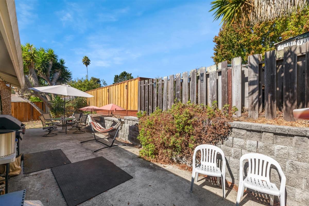 406 Pine Street, Unit A Capitola, CA 95010 - Photo 24 of 32 a view of a chair and tables in the patio
