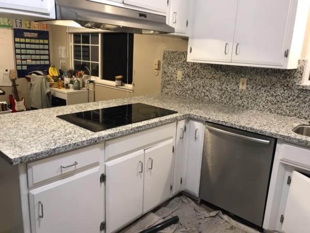 406 Pine Street, Unit A Capitola, CA 95010 - Photo 27 of 32 a kitchen with a sink and cabinets