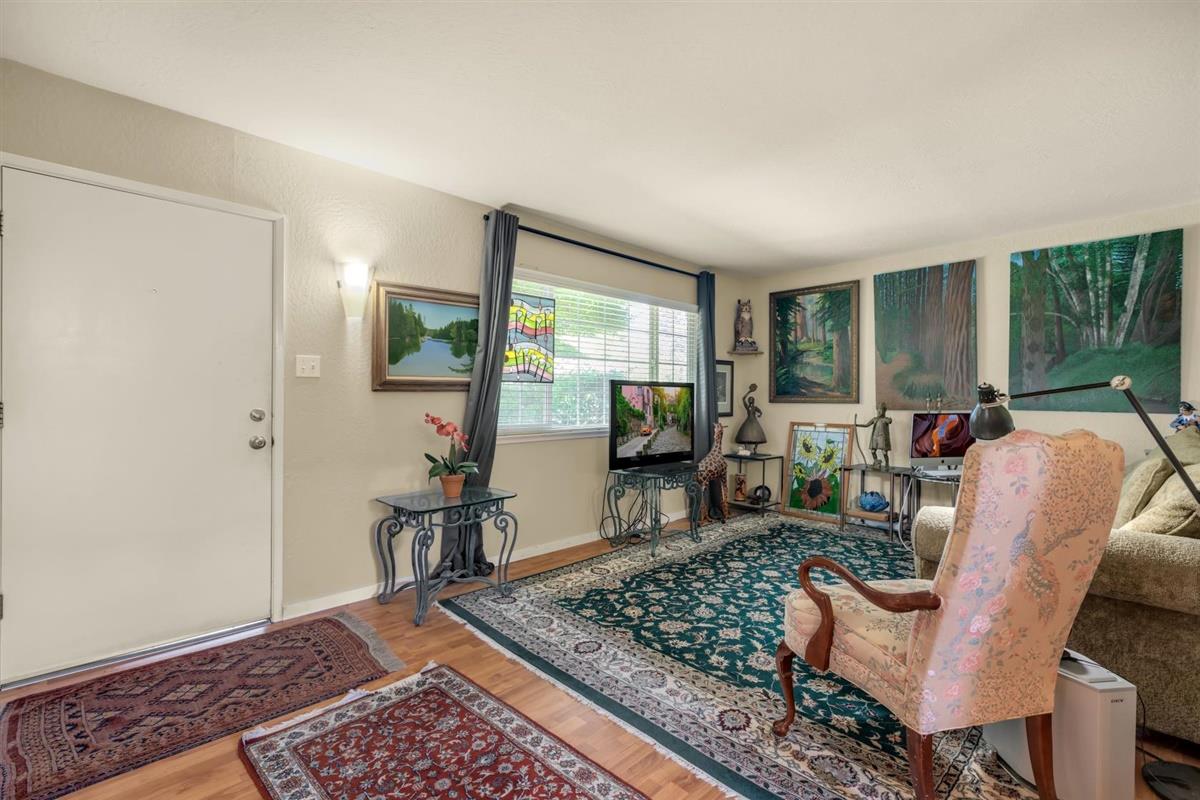 406 Pine Street, Unit A Capitola, CA 95010 - Photo 7 of 32 a living room with furniture rug and window