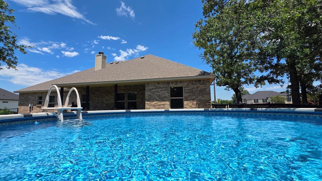 223 Cottongame Road Weatherford, TX 76088 - Photo 30 of 39 a view of house with yard and entertaining space