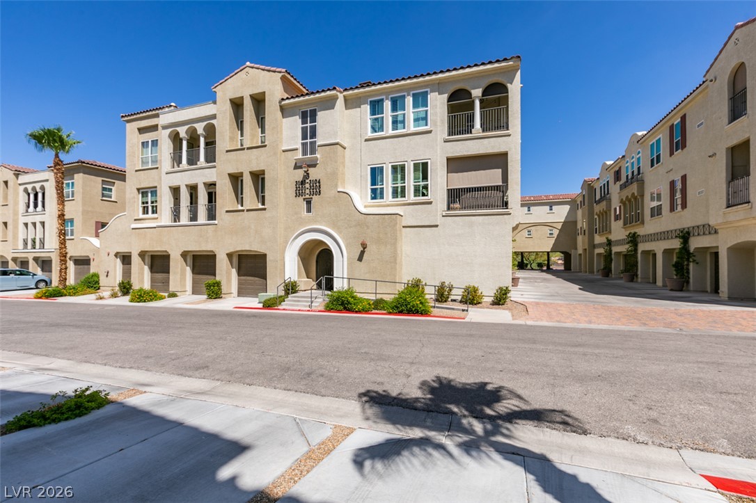 2555 Hampton Road, Unit 3203 Henderson, NV 89052 - Photo 3 of 43 Mediterranean-inspired multi-story design shines under clear blue desert skies.