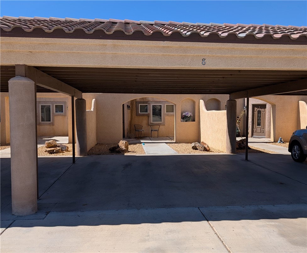 a view of swimming pool with seating space and ocean view