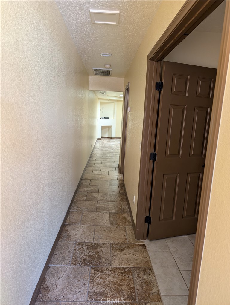 27160 Vista Road, Unit 8 Helendale, CA 92342 - Photo 3 of 12 a view of a hallway