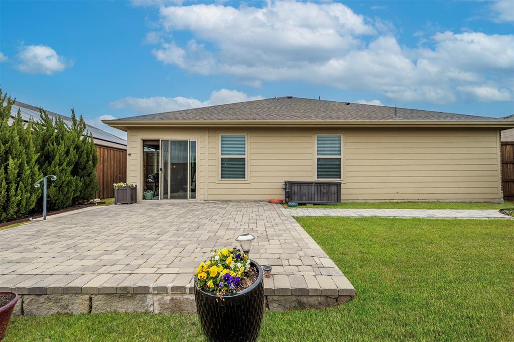910 Community Way Royse City, TX 75189 - Photo 18 of 27 a front view of a house with a yard