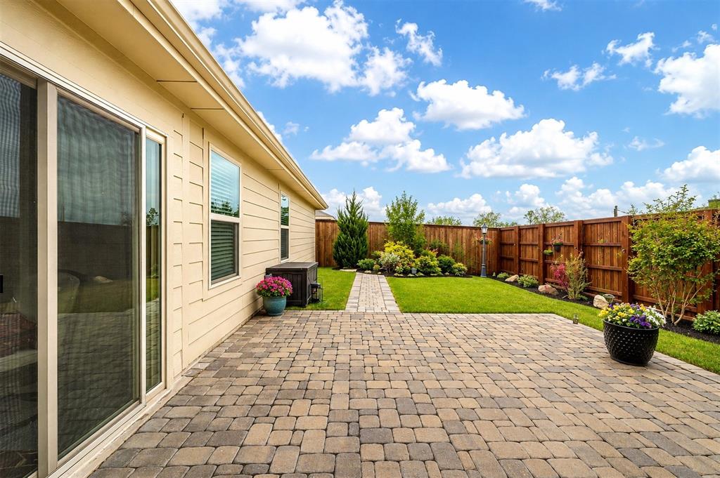 910 Community Way Royse City, TX 75189 - Photo 2 of 27 a view of a back yard of the house and a chair