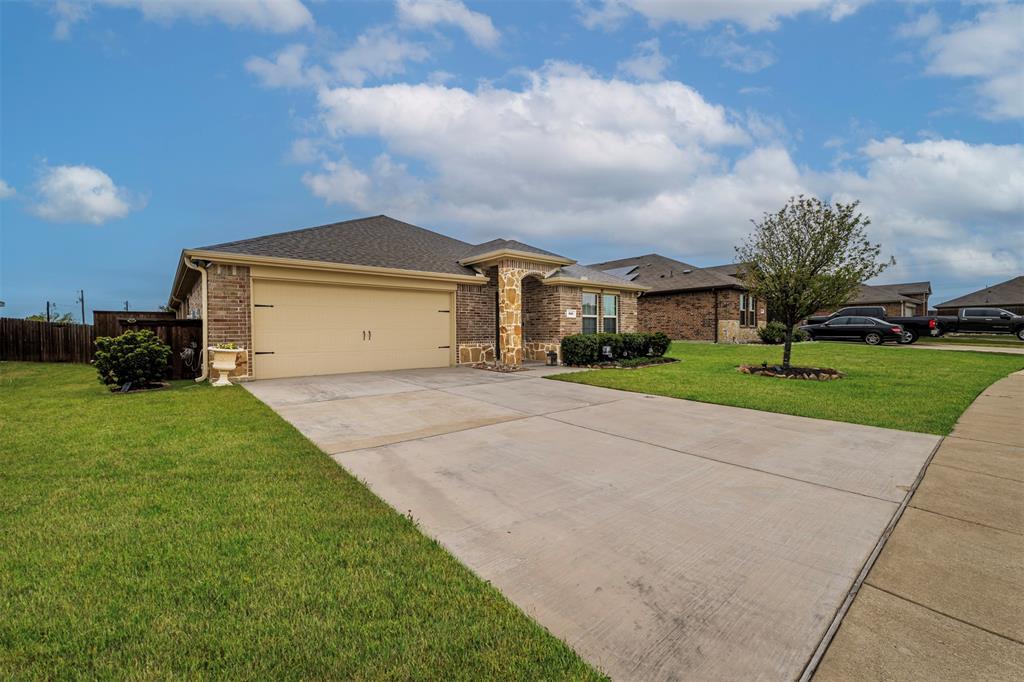 910 Community Way Royse City, TX 75189 - Photo 23 of 27 a front view of house with yard and green space