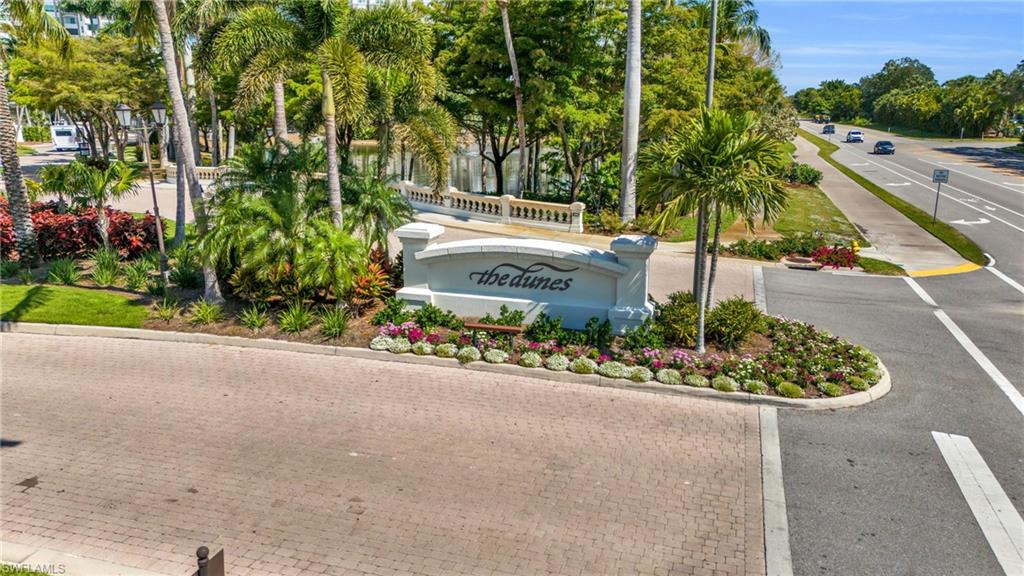 265 Indies Way, Unit 1402 Naples, FL 34110 - Photo 12 of 45 View of community / neighborhood sign