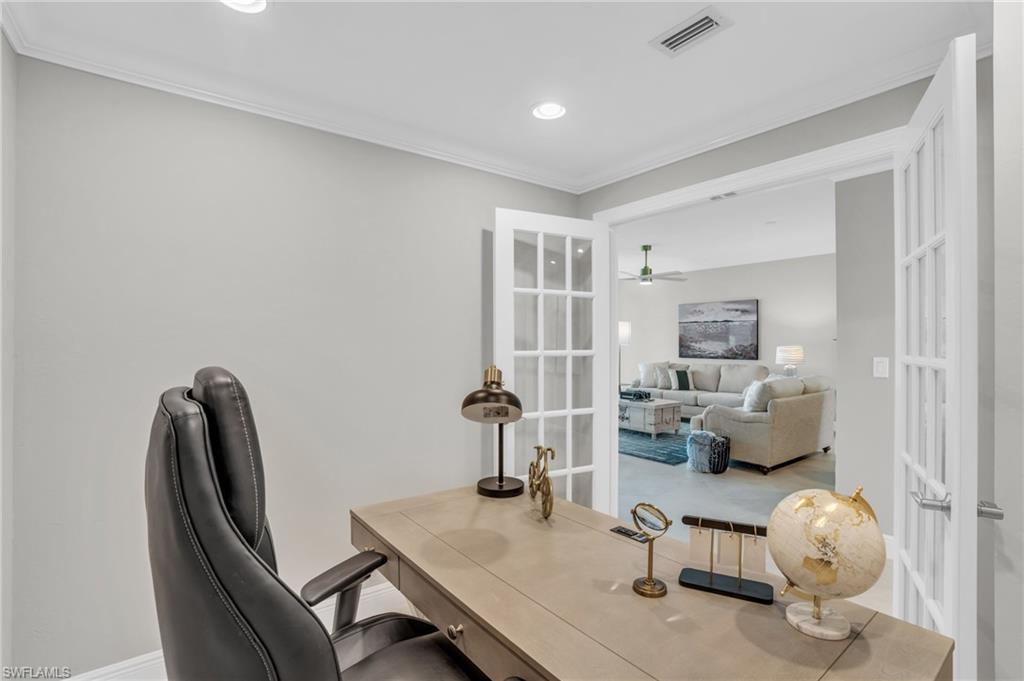 265 Indies Way, Unit 1402 Naples, FL 34110 - Photo 26 of 45 Home office featuring ceiling fan, french doors, and crown molding