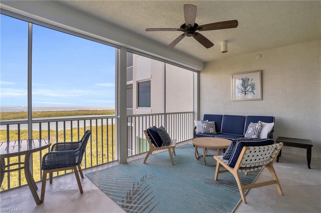 265 Indies Way, Unit 1402 Naples, FL 34110 - Photo 3 of 45 Sunroom / solarium with ceiling fan