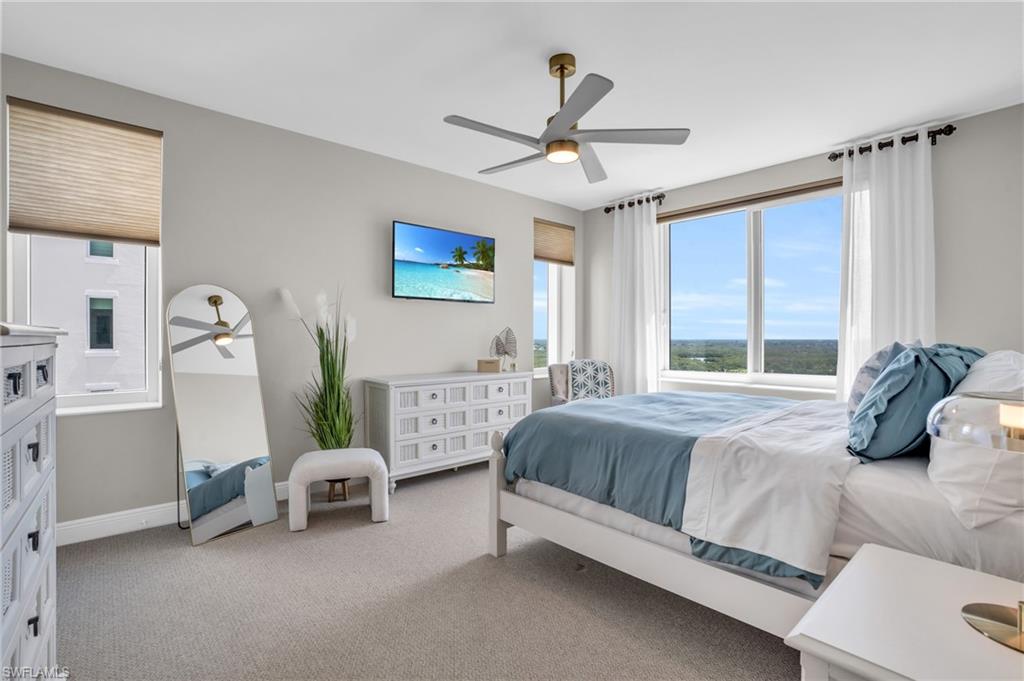 265 Indies Way, Unit 1402 Naples, FL 34110 - Photo 32 of 45 Carpeted bedroom featuring ceiling fan