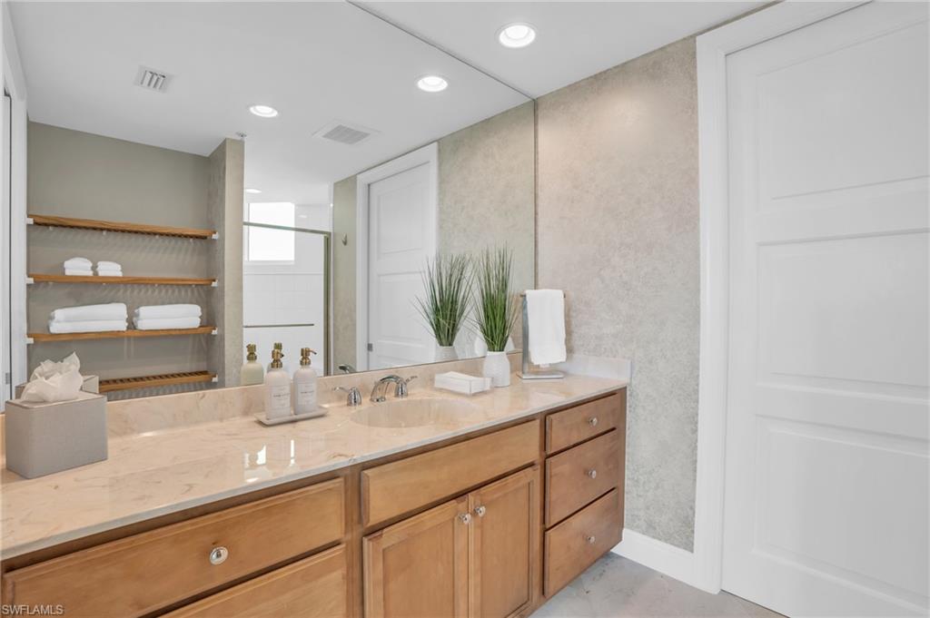 265 Indies Way, Unit 1402 Naples, FL 34110 - Photo 36 of 45 Bathroom with vanity and a shower