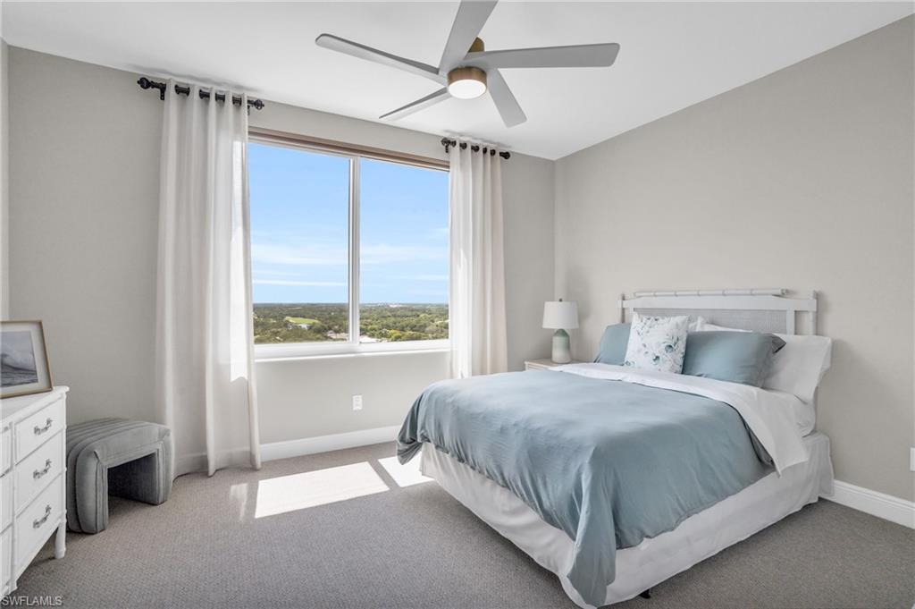 265 Indies Way, Unit 1402 Naples, FL 34110 - Photo 37 of 45 Bedroom featuring ceiling fan and carpet floors