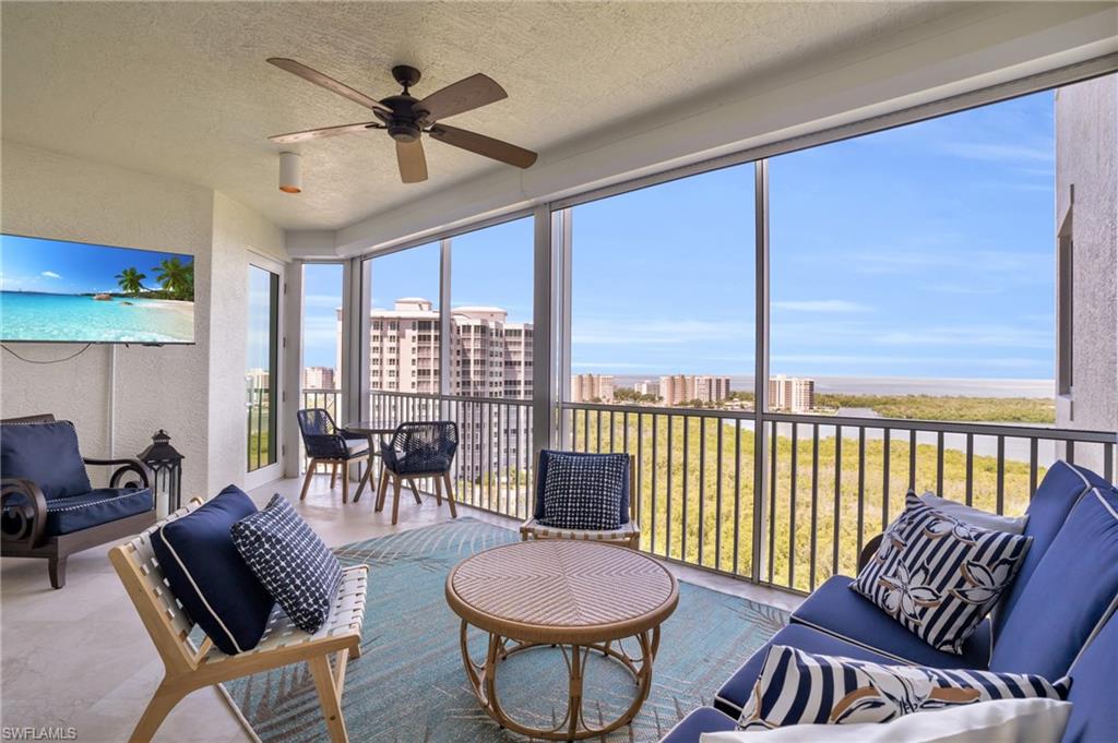 265 Indies Way, Unit 1402 Naples, FL 34110 - Photo 4 of 45 Sunroom featuring ceiling fan