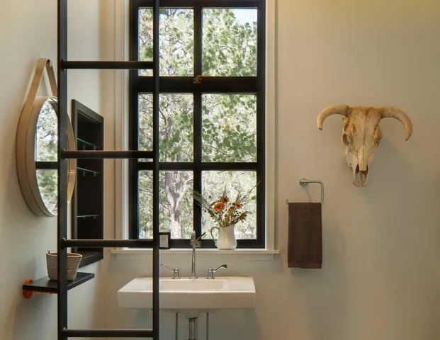 a bathroom with a sink and a window