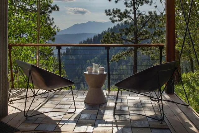 a view of a balcony with chairs
