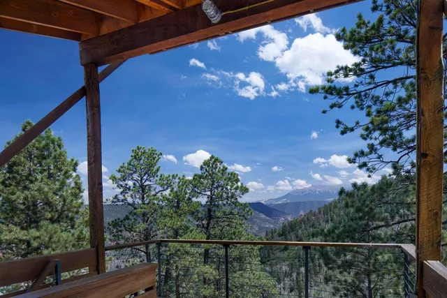 a view of a wooden dinning table and chairs