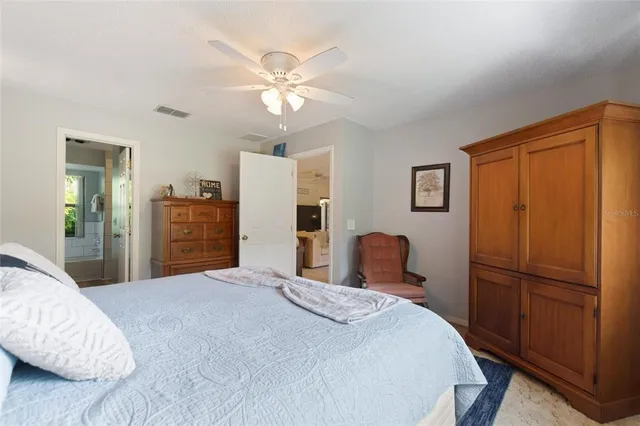 a view of a house with backyard porch and sitting area