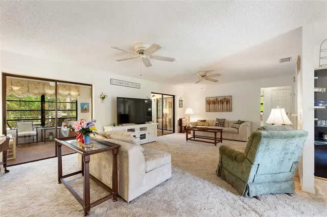 a kitchen with stainless steel appliances granite countertop a refrigerator sink and cabinets