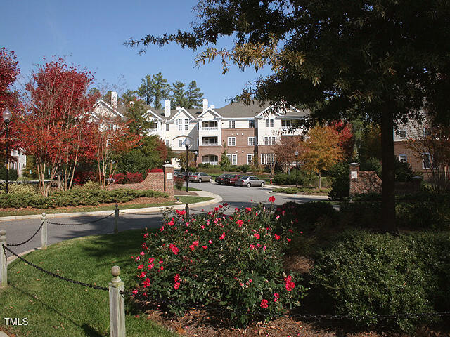 a view of street with houses and trees