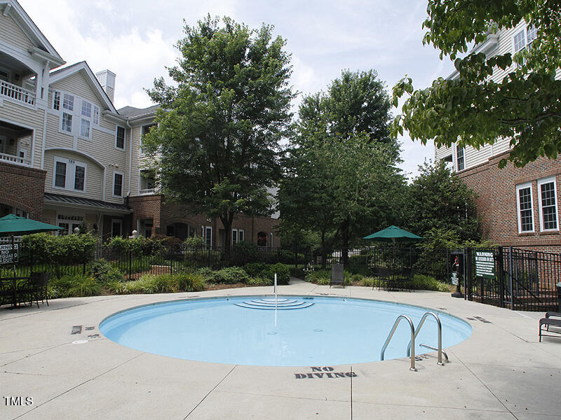 108-201 Northbrook Drive Raleigh, NC 27609 - Photo 11 of 32 a view of swimming pool with outdoor seating and plants