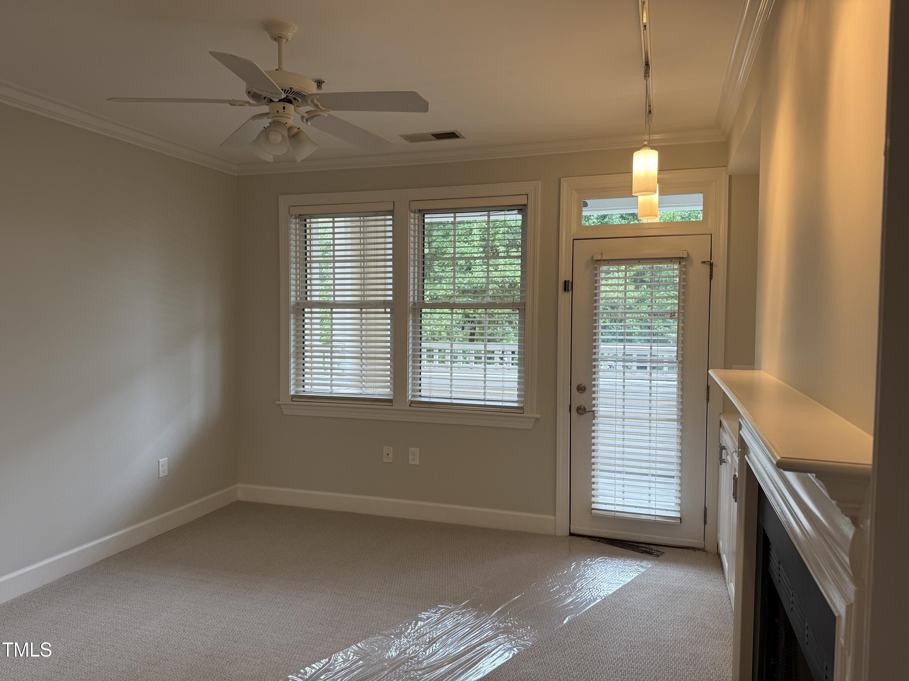 108-201 Northbrook Drive Raleigh, NC 27609 - Photo 20 of 32 a view of an empty room with a window
