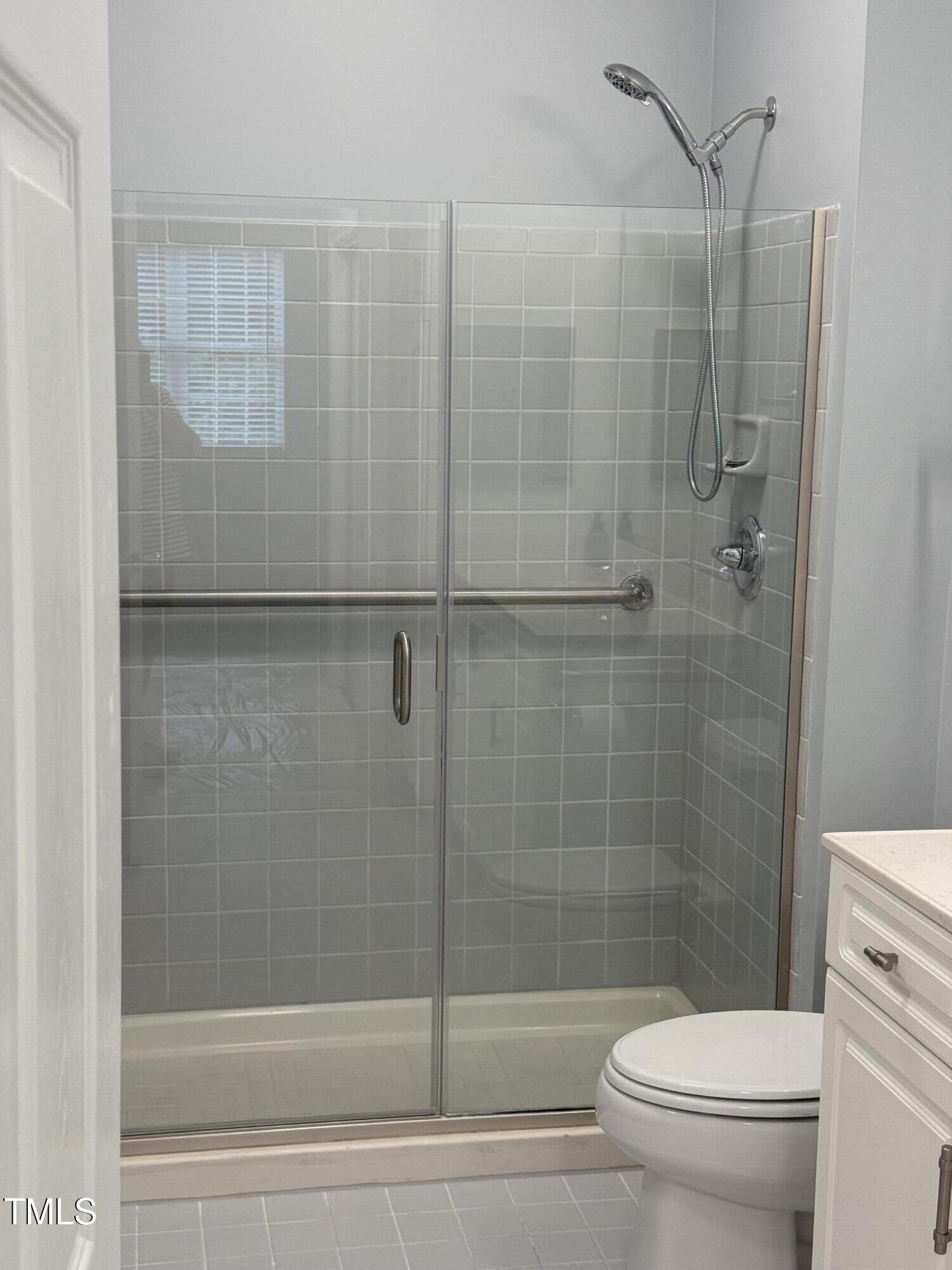 108-201 Northbrook Drive Raleigh, NC 27609 - Photo 28 of 32 a bathroom with a toilet and shower