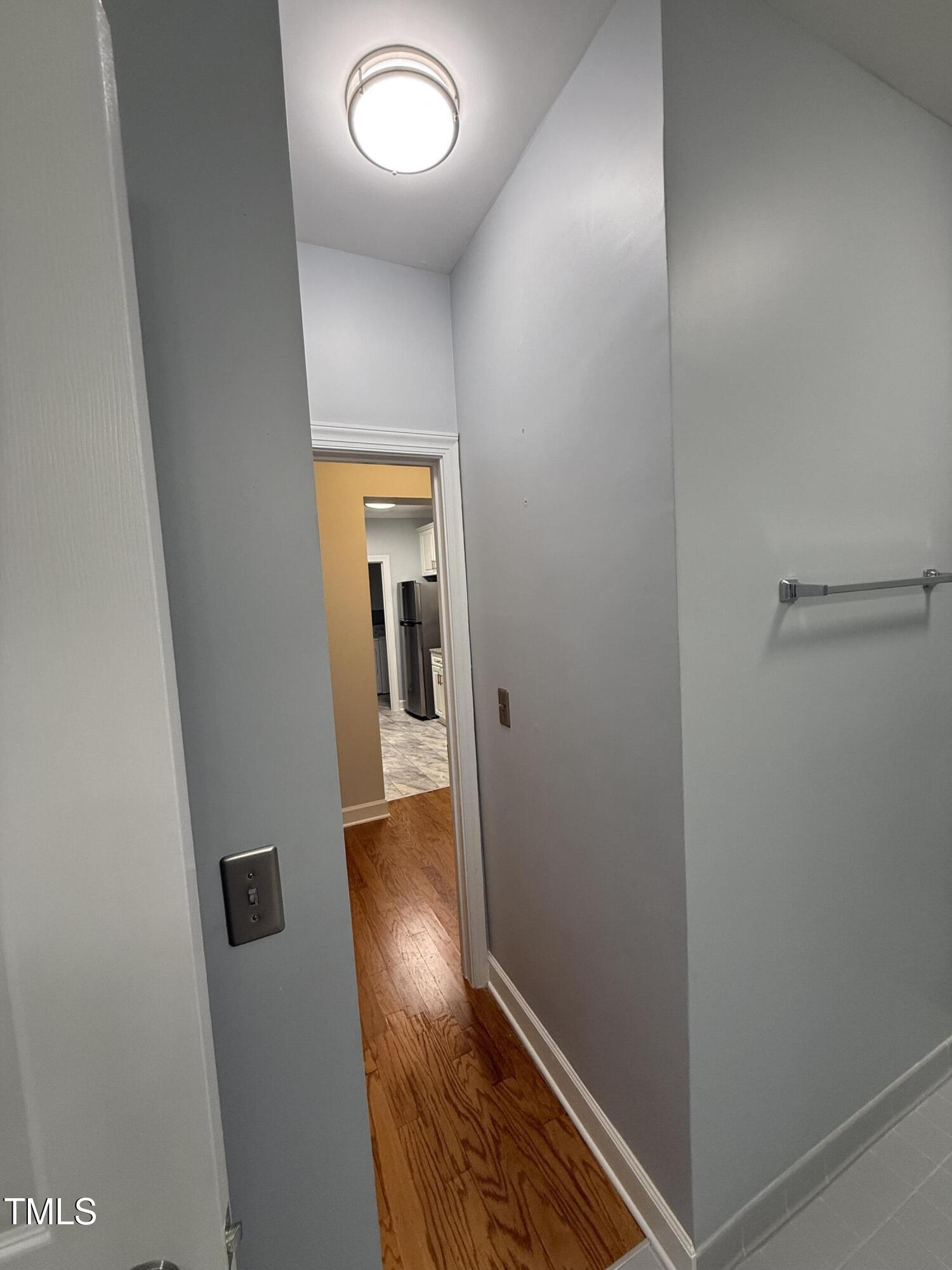 108-201 Northbrook Drive Raleigh, NC 27609 - Photo 29 of 32 a view of hallway with wooden floor