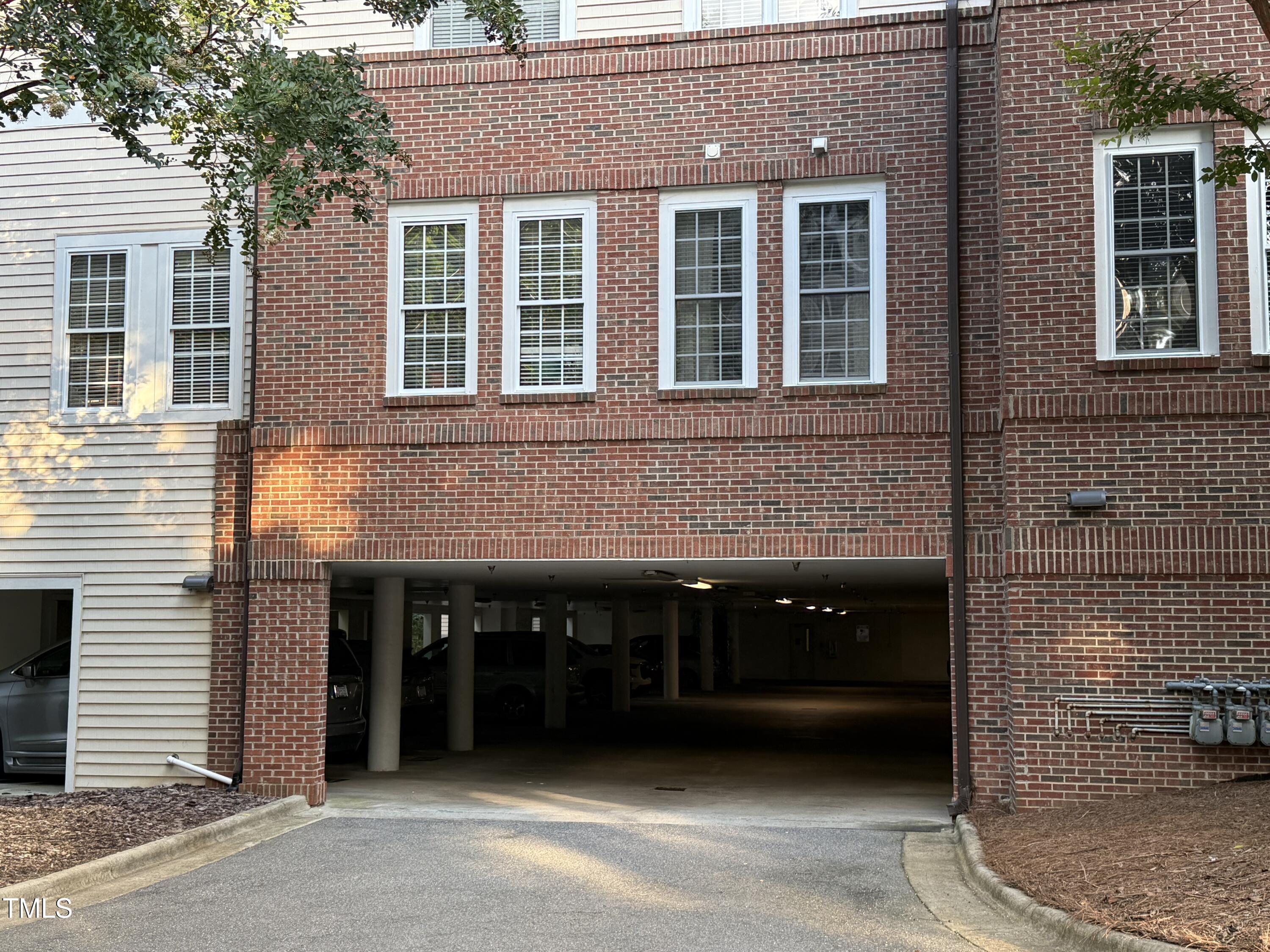 108-201 Northbrook Drive Raleigh, NC 27609 - Photo 6 of 32 a black and white building with a window