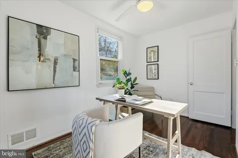 a bedroom with a large bed and a couch