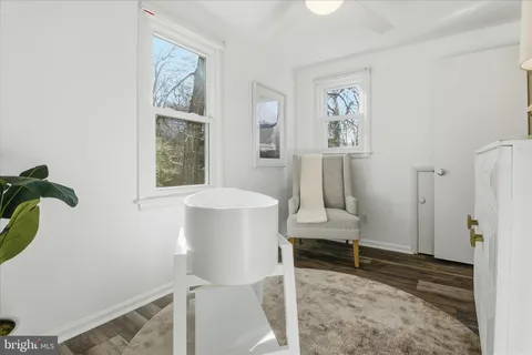 a backyard of a house with barbeque oven table and chairs