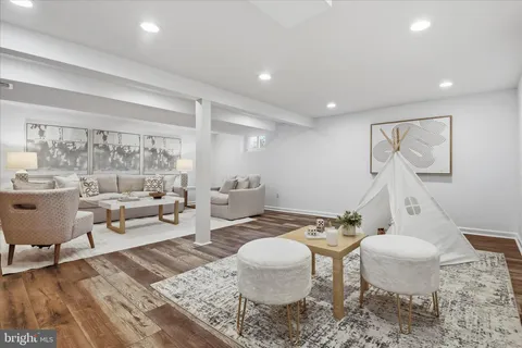 a view of backyard with table and chairs and a large tree