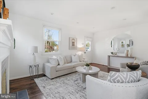 a living room with furniture and a rug