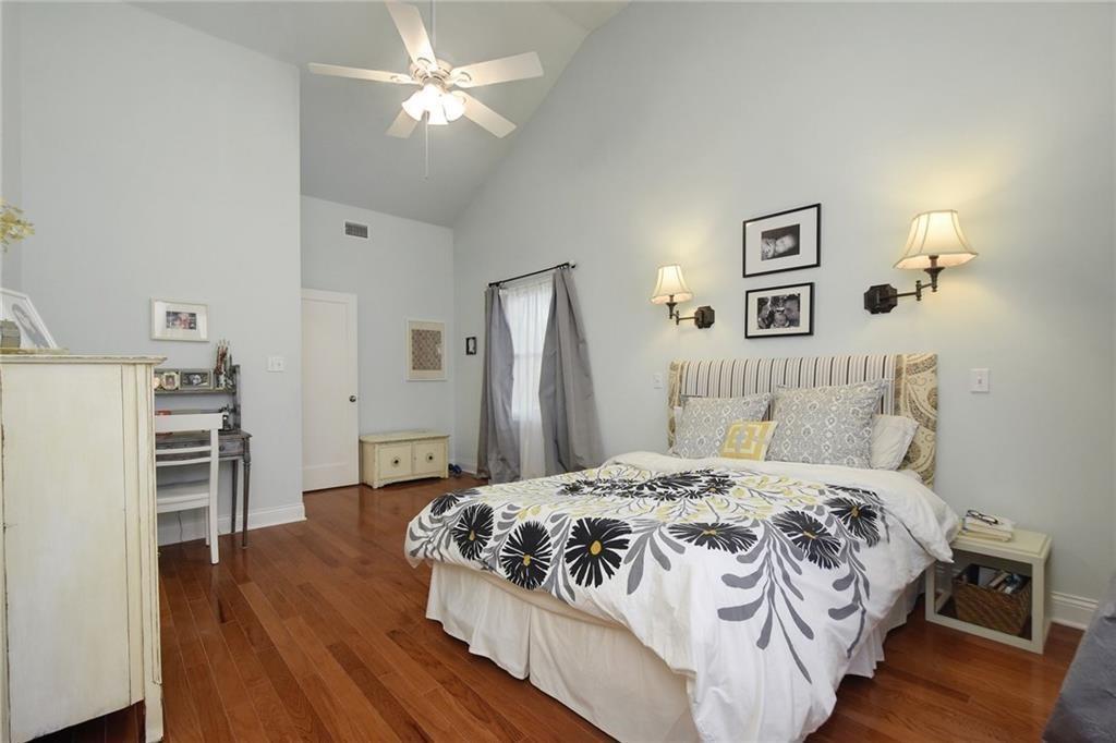 4412 Barrow Avenue, Unit A Austin, TX 78751 - Photo 14 of 28 Bedroom featuring high vaulted ceiling, dark wood finished floors, and ceiling fan