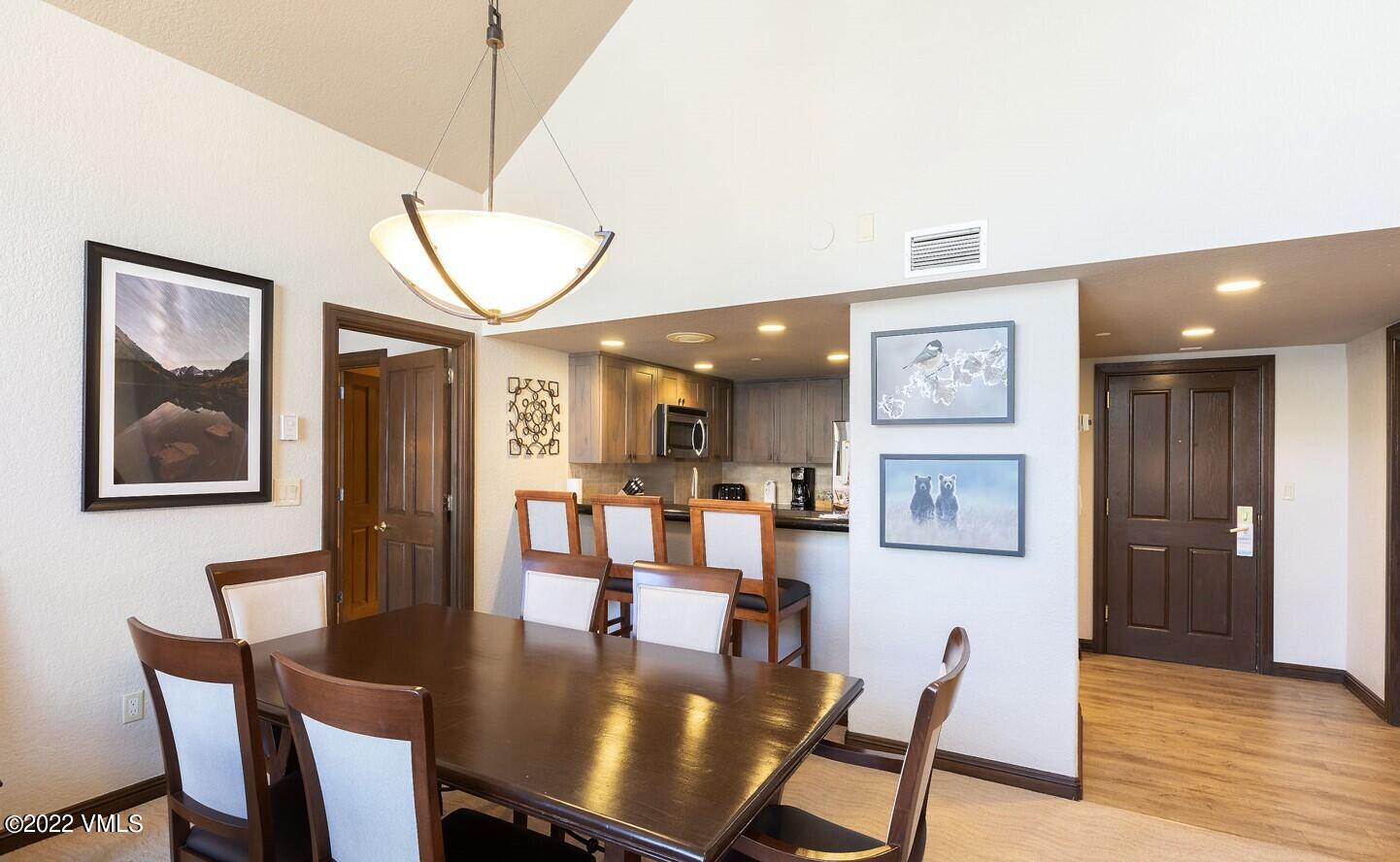 210 Offerson Road, Unit R421 / WEEK 47 Beaver Creek, CO 81620 - Photo 14 of 20 a view of a dining room with furniture and wooden floor