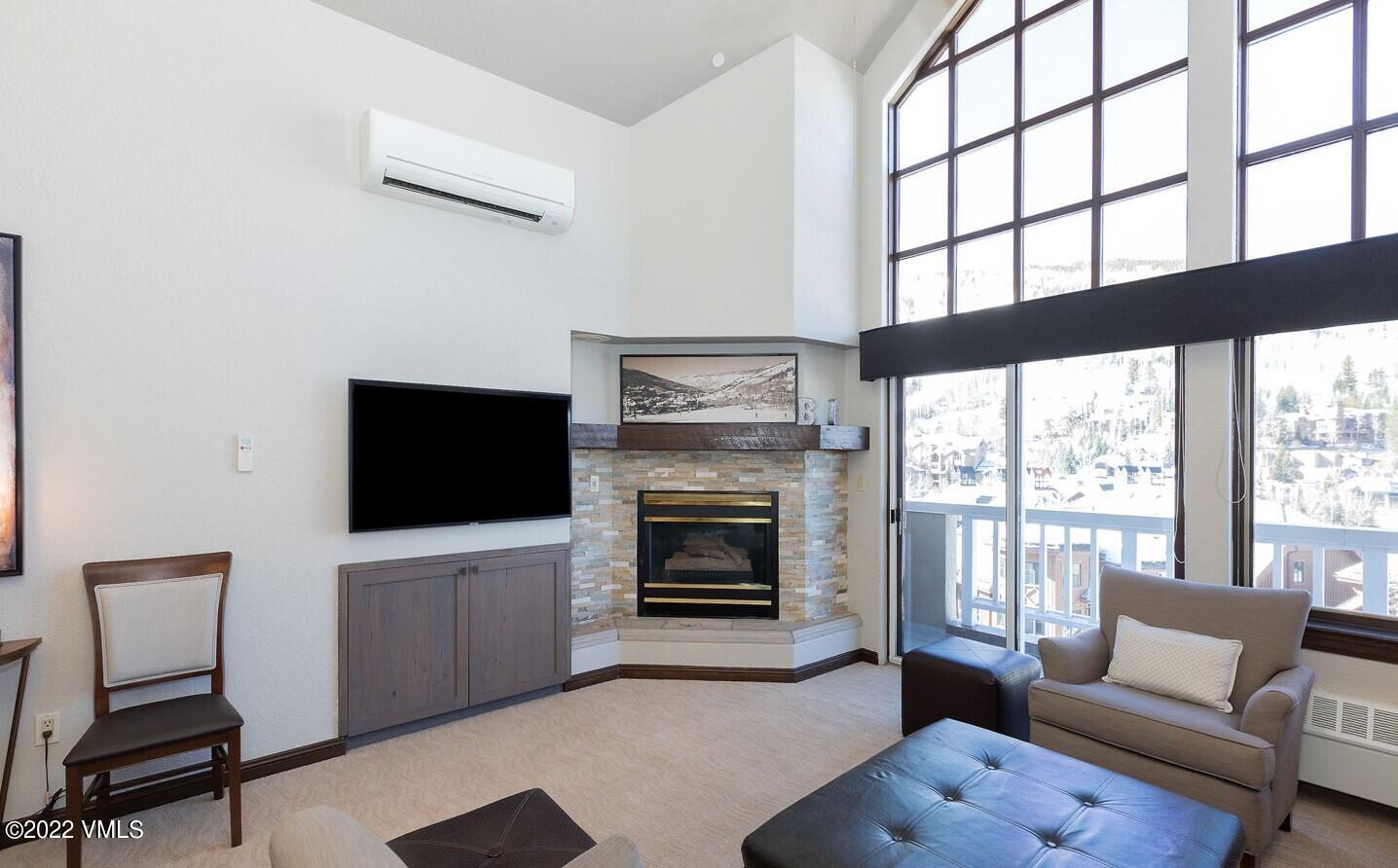 210 Offerson Road, Unit R421 / WEEK 47 Beaver Creek, CO 81620 - Photo 16 of 20 a living room with furniture a flat screen tv and a fireplace