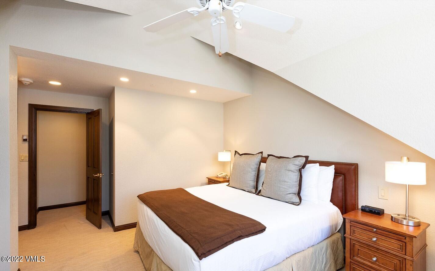 210 Offerson Road, Unit R421 / WEEK 47 Beaver Creek, CO 81620 - Photo 9 of 20 a bedroom with a bed and a night stand