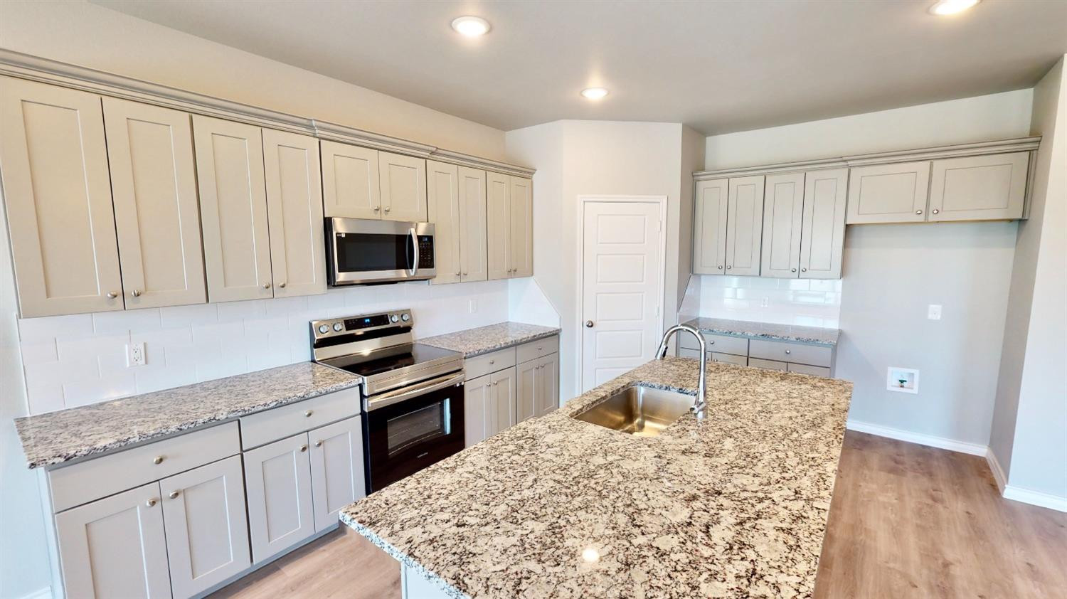 5804 Waverly Lubbock, TX 79407 - Photo 14 of 26 a kitchen with a sink stove and refrigerator