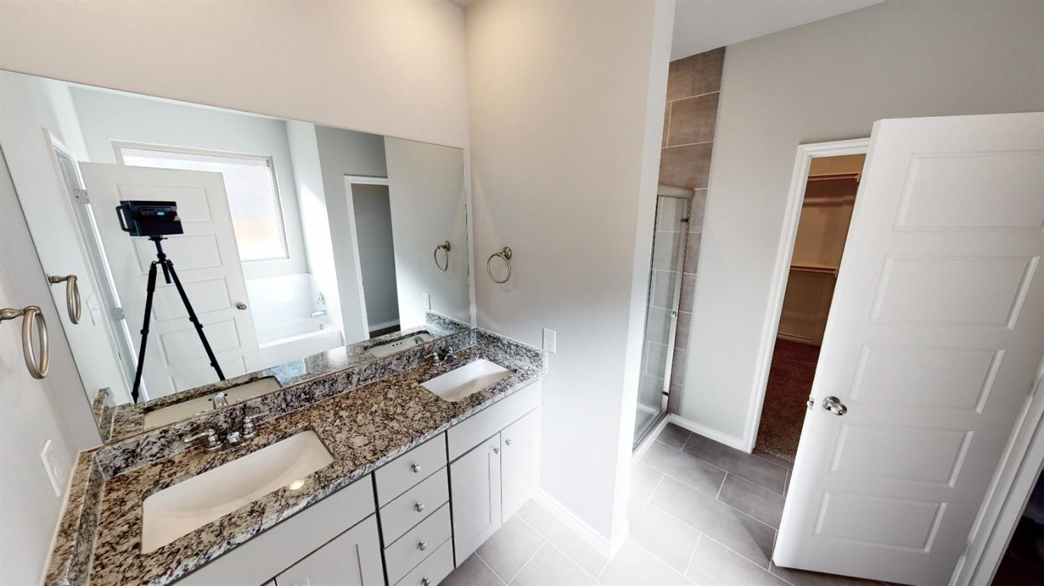 5804 Waverly Lubbock, TX 79407 - Photo 18 of 26 a bathroom with a granite countertop sink and a mirror