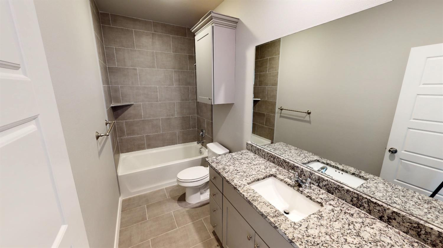 5804 Waverly Lubbock, TX 79407 - Photo 5 of 26 a bathroom with a granite countertop sink toilet and shower