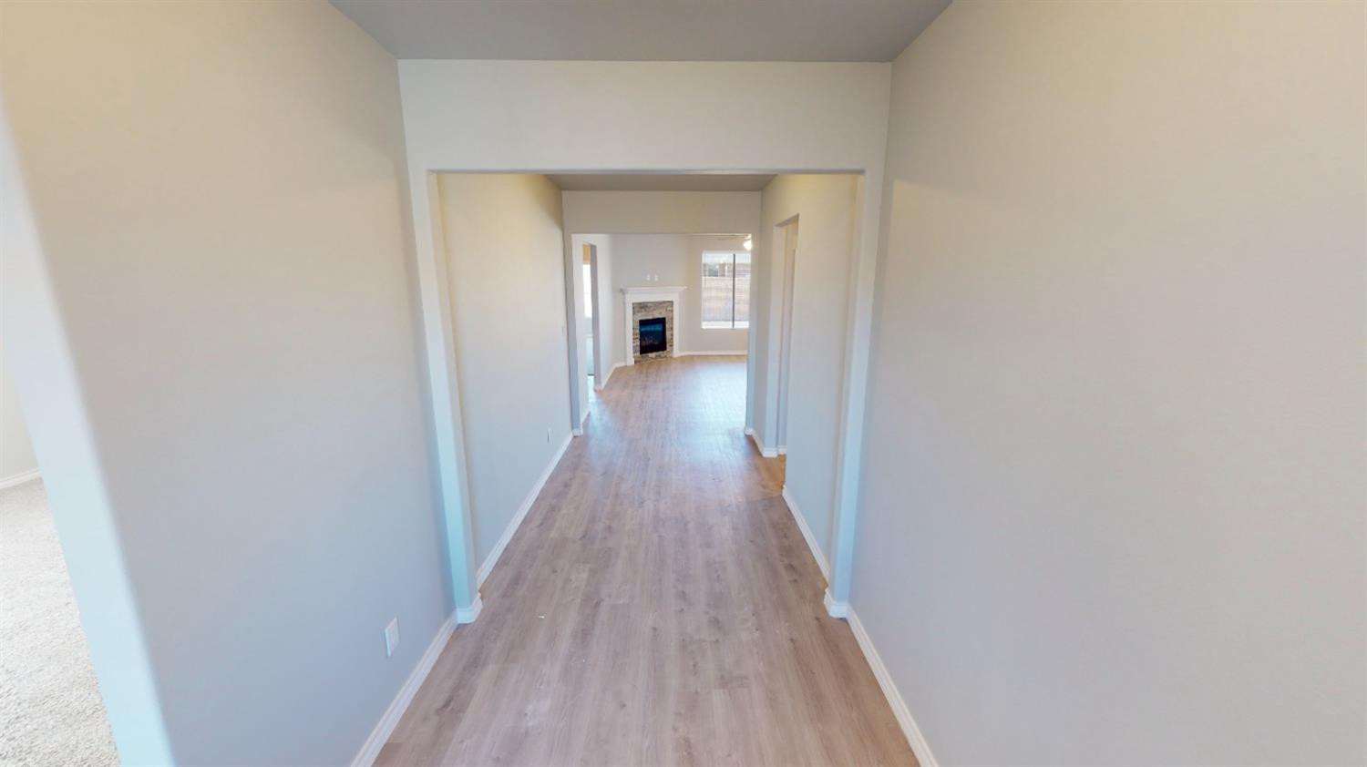 5804 Waverly Lubbock, TX 79407 - Photo 6 of 26 a view of a hallway with wooden floor