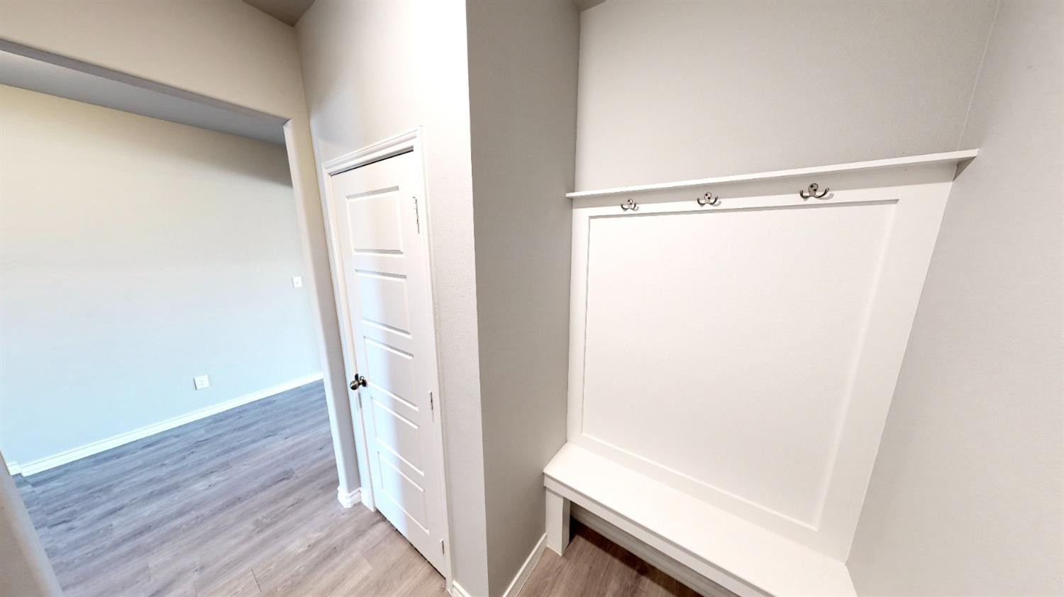 5804 Waverly Lubbock, TX 79407 - Photo 10 of 26 a view of a room with wooden floor and bench