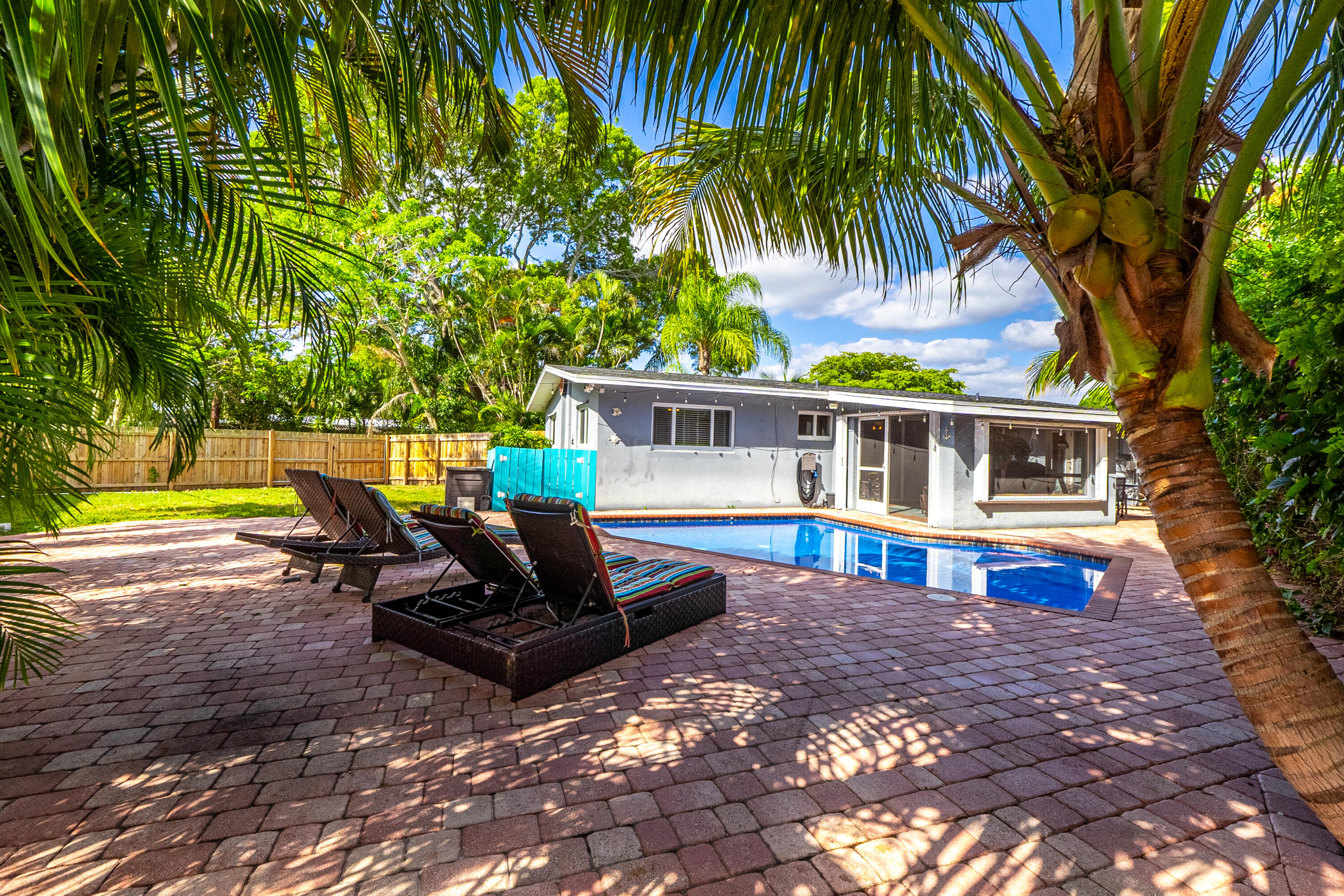 400 Pittsburgh Drive Jupiter, FL 33458 - Photo 1 of 30 a view of house with swimming pool outdoor seating