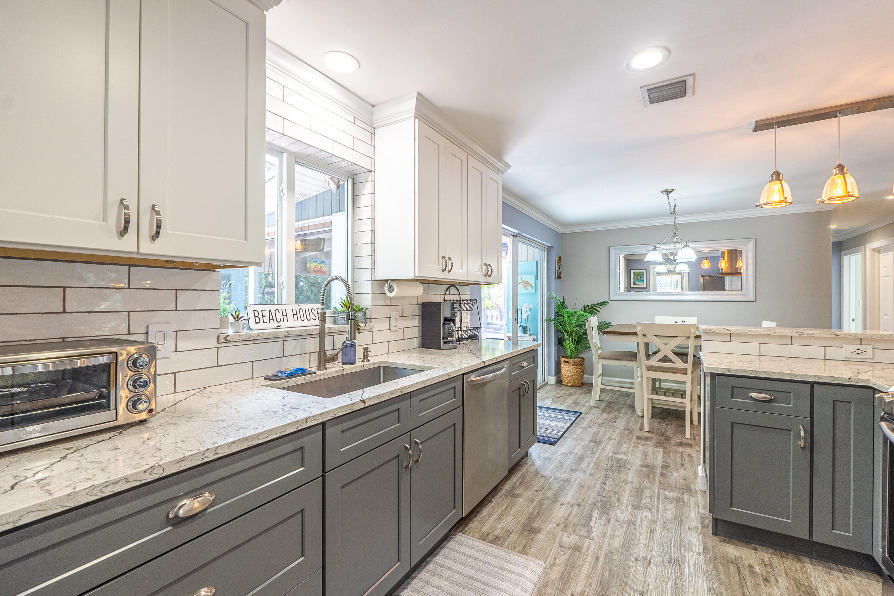 400 Pittsburgh Drive Jupiter, FL 33458 - Photo 11 of 30 a kitchen with lots of counter space and a sink